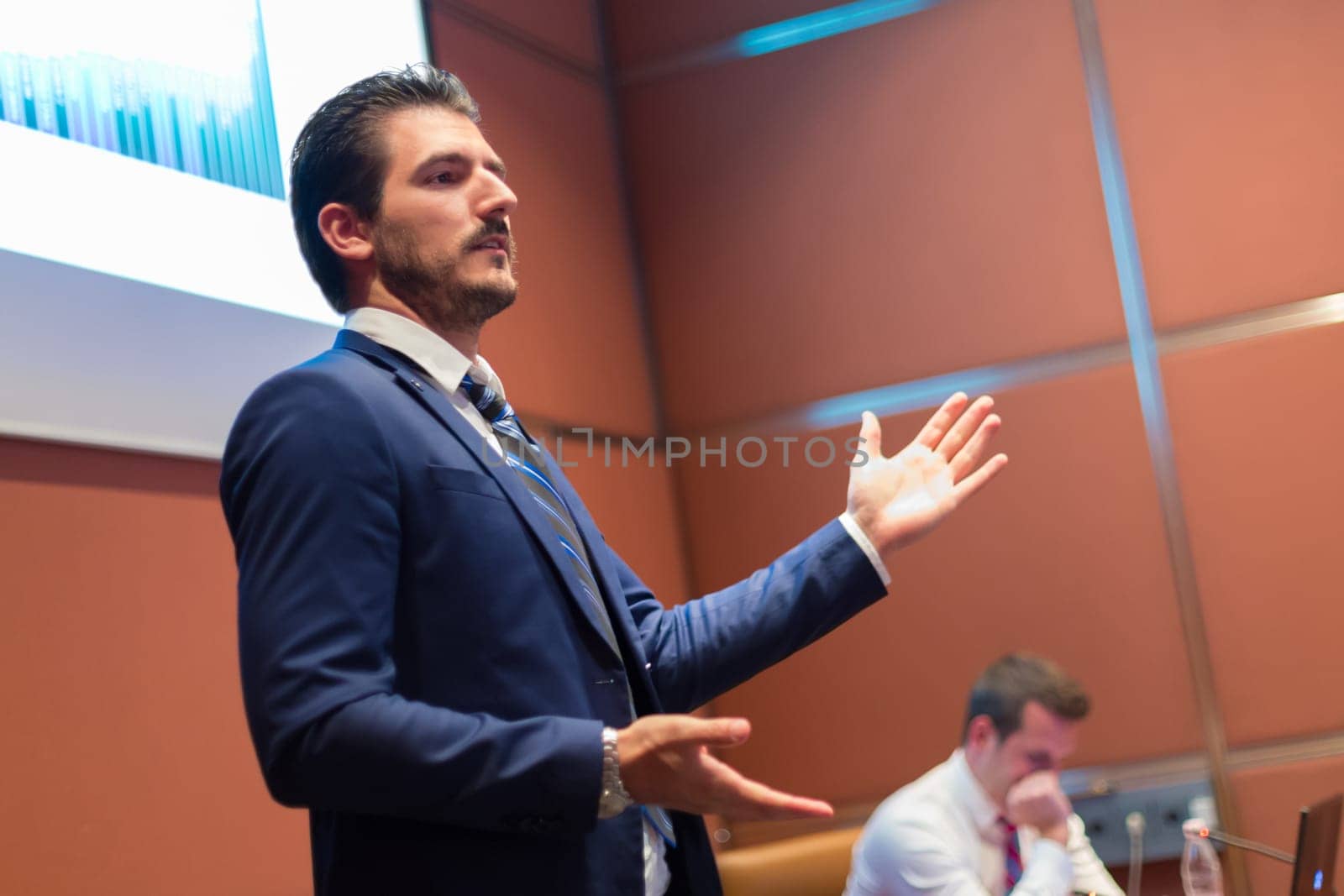Speaker giving talk on podium at Business Conference. Entrepreneurship club. Horisontal composition.