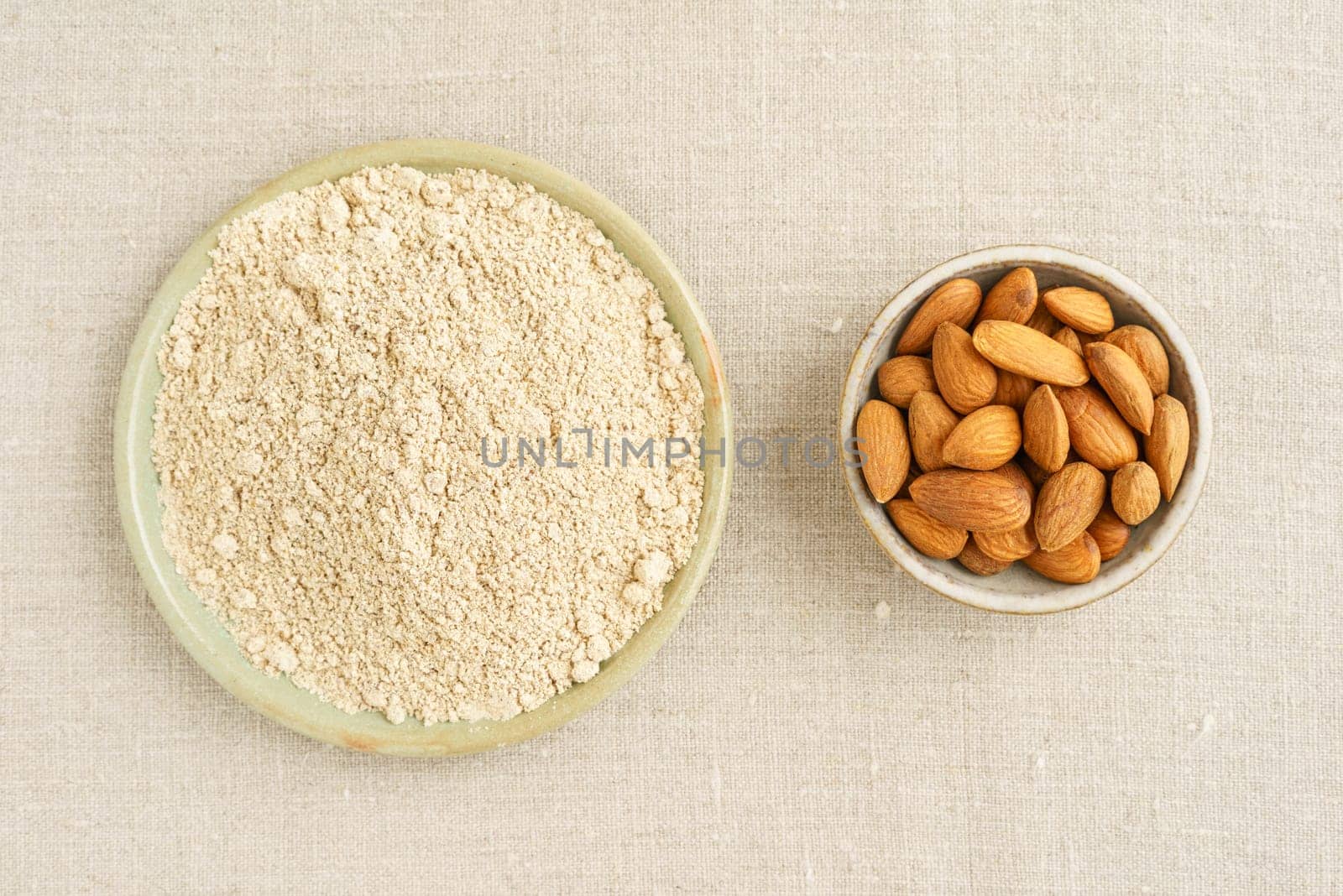 Almonds and almond flour in small potted bowls