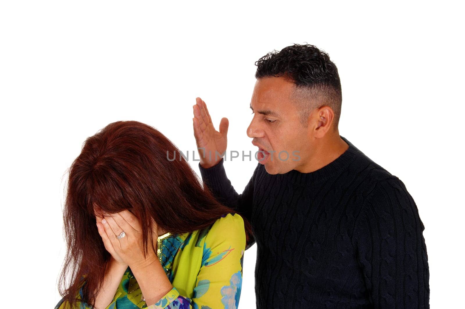 An Hispanic man shouting at his Caucasian wife lifting his hand, domestic.violence, isolated for white background..