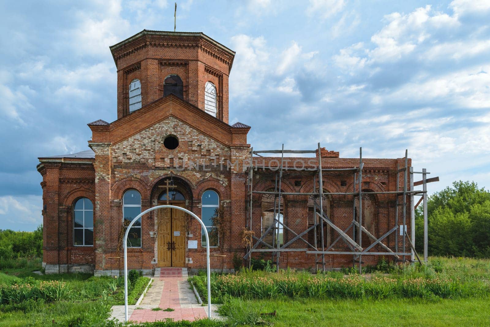 Ancient Orthodox church of bricks in the countryside, situated on the restoration.