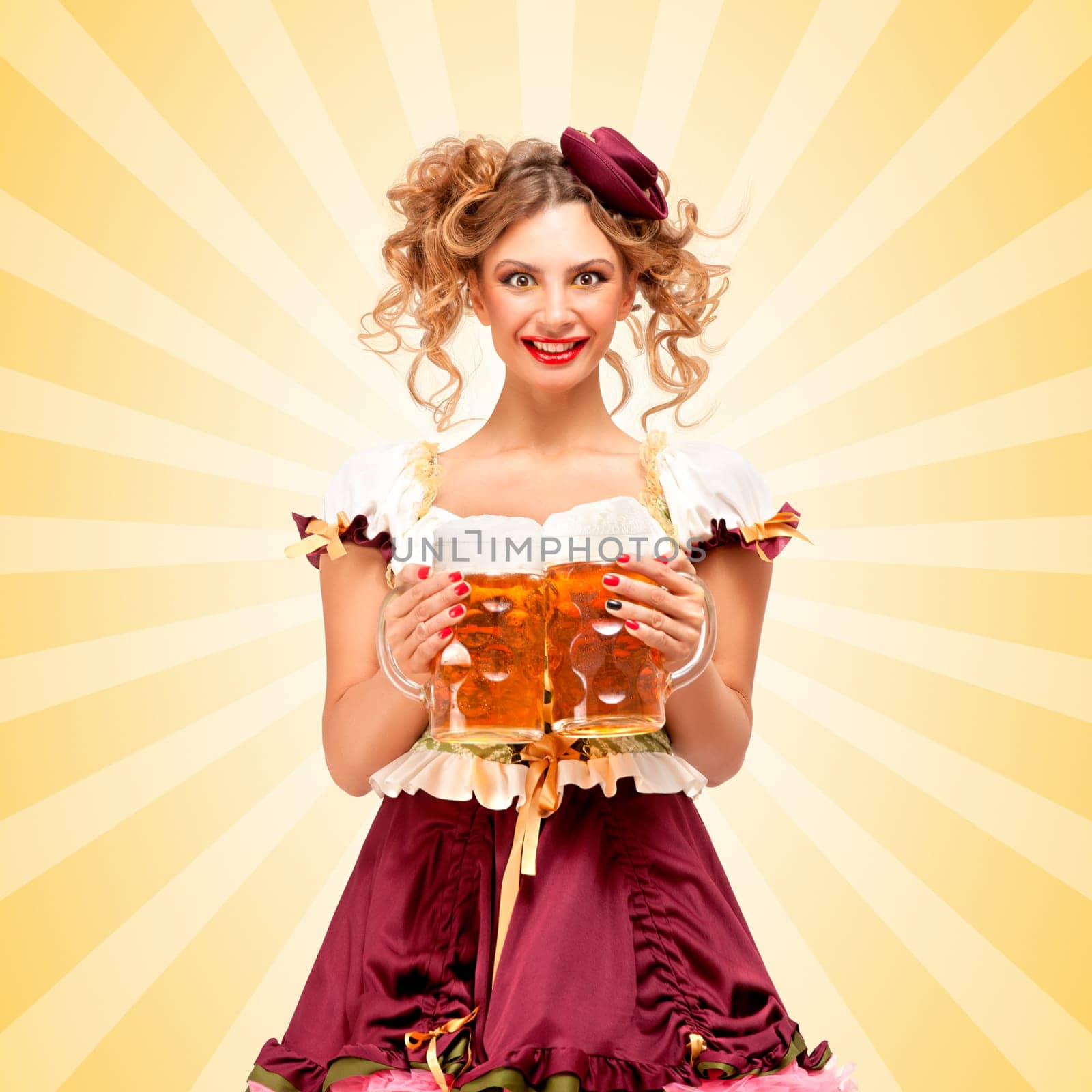 Beautiful sexy Oktoberfest waitress, wearing a traditional Bavarian dress dirndl, serving two big beer mugs in a tavern and smiling on colorful abstract cartoon style background.