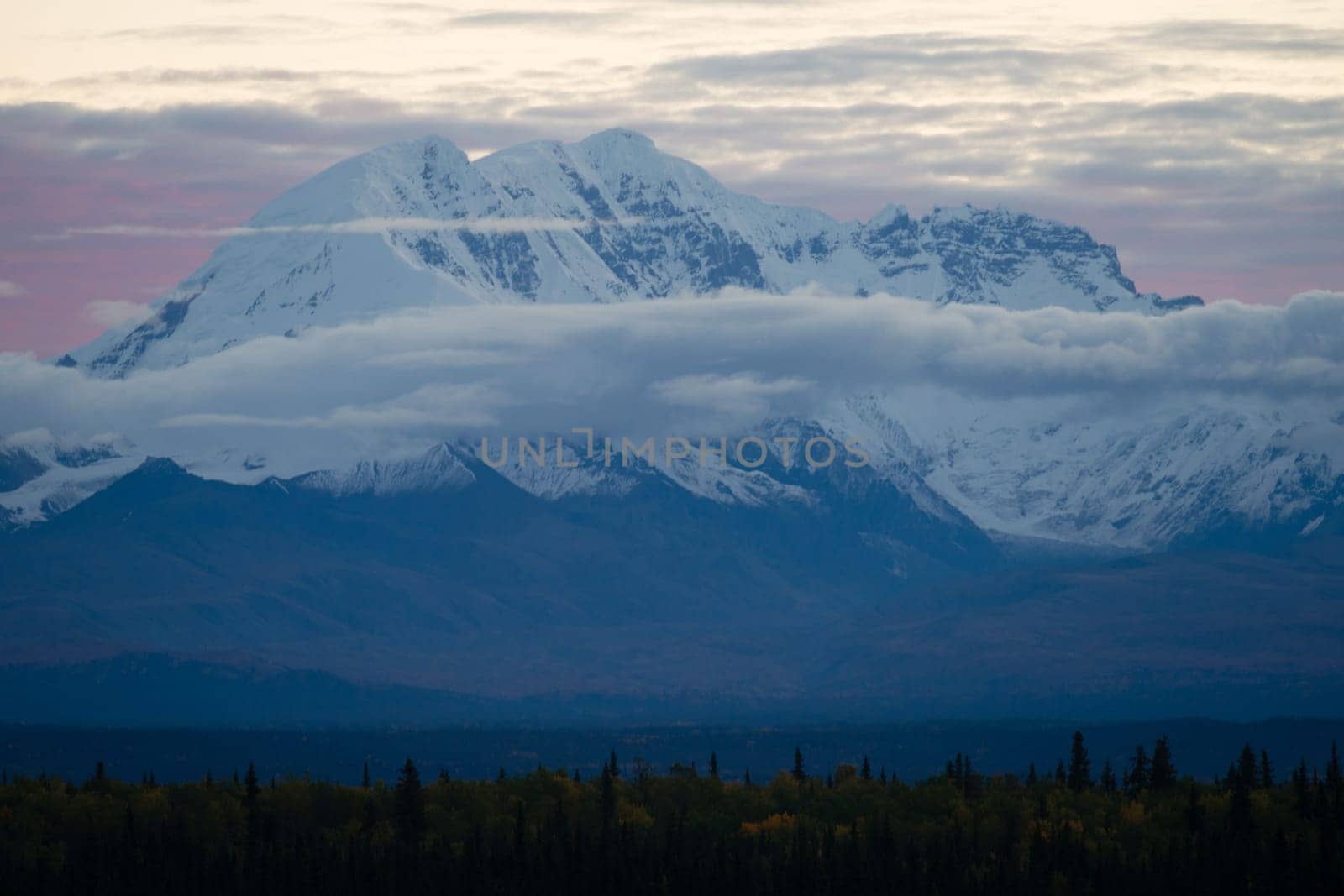 Sunrise happens behind Mt. Drum in remote Alaska