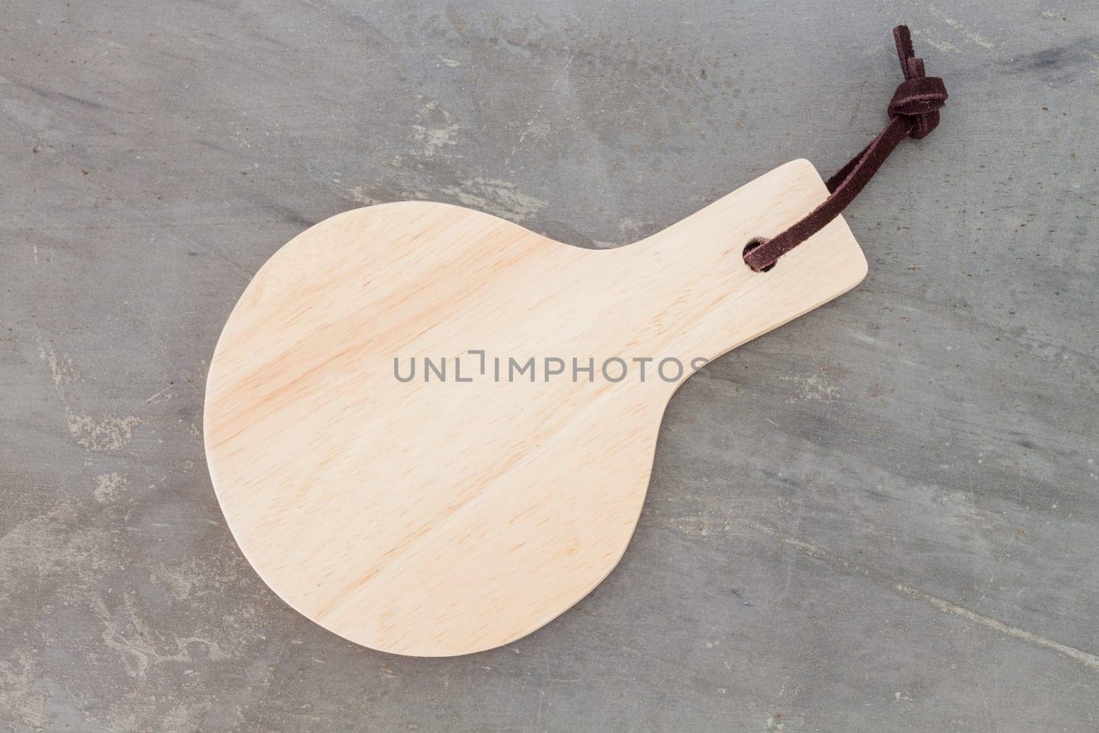 Wooden plate on grey background, stock photo
