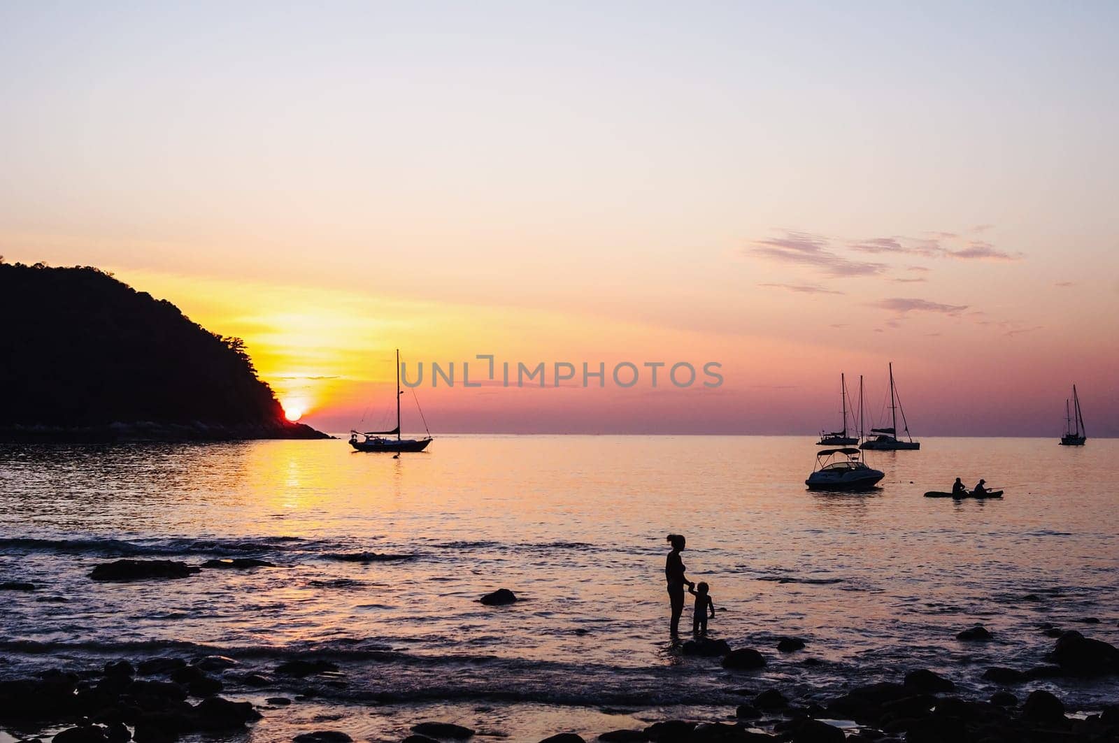 People in seascape with beautiful light from the sun and sky background, Phuket thailand