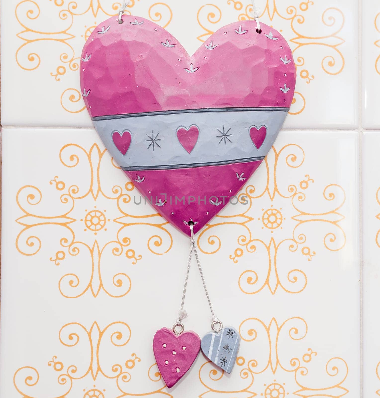 Heart with two large ceramic ceramic hearts on the wall