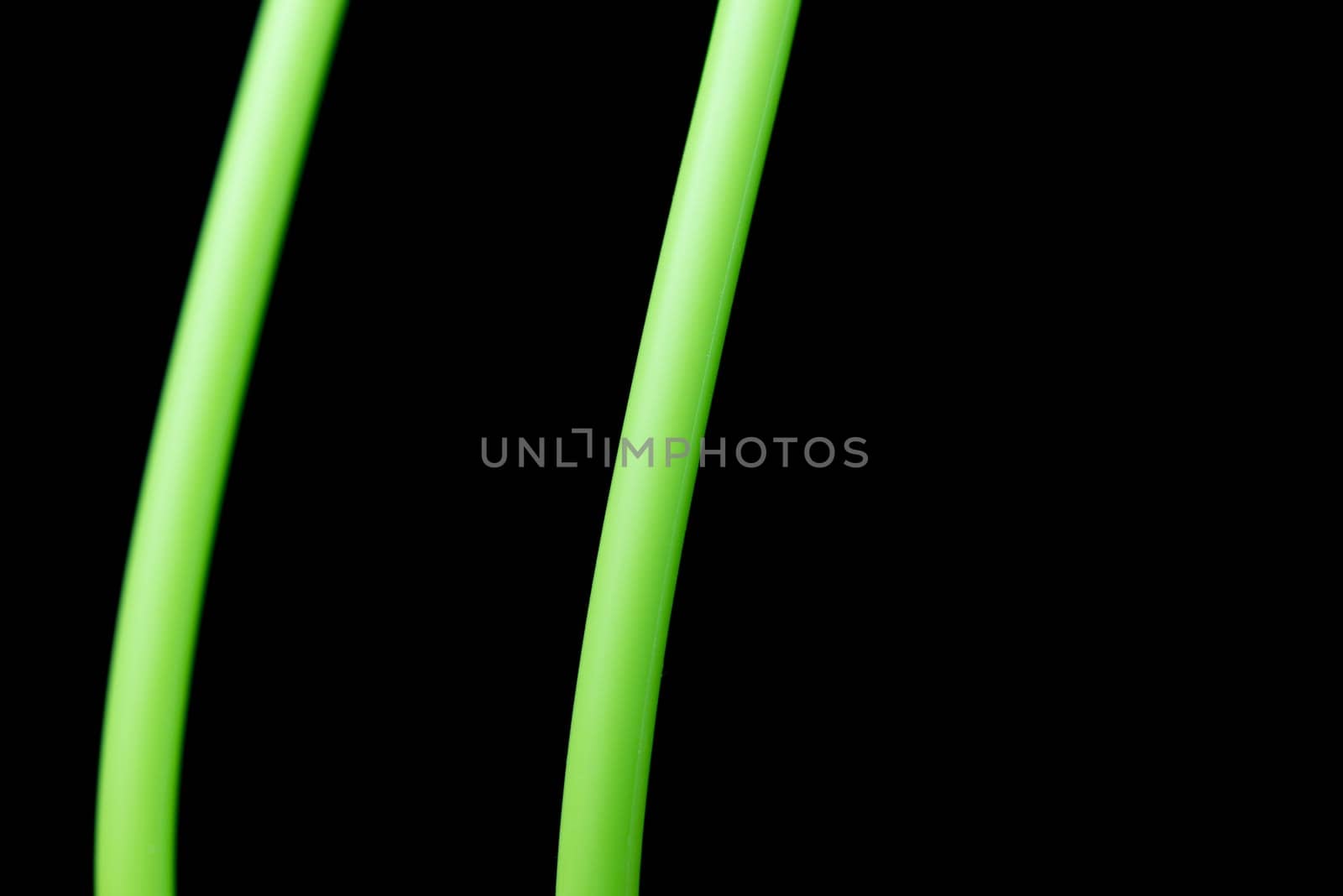 An abstract macro shot of green lines on a pure black background.