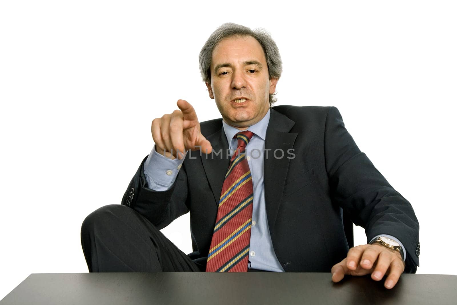 mature business man on a desk, isolated on white