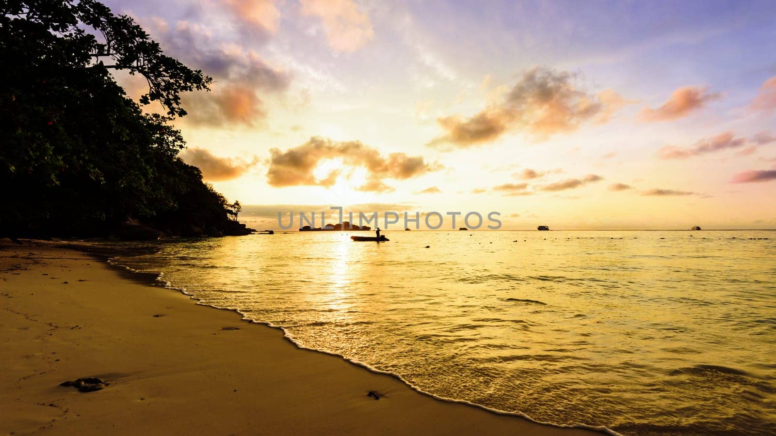 Beautiful landscapes of golden light the sky over the beach and sea during sunrise on Koh Miang Islands, Mu Ko Similan National Park, Phang Nga, Thailand, 16