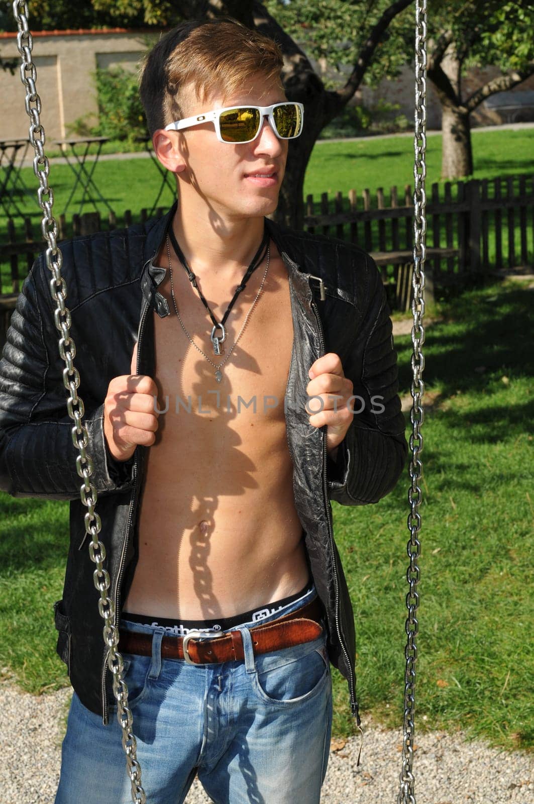 Good-looking young man posing in nature,stylish,modern