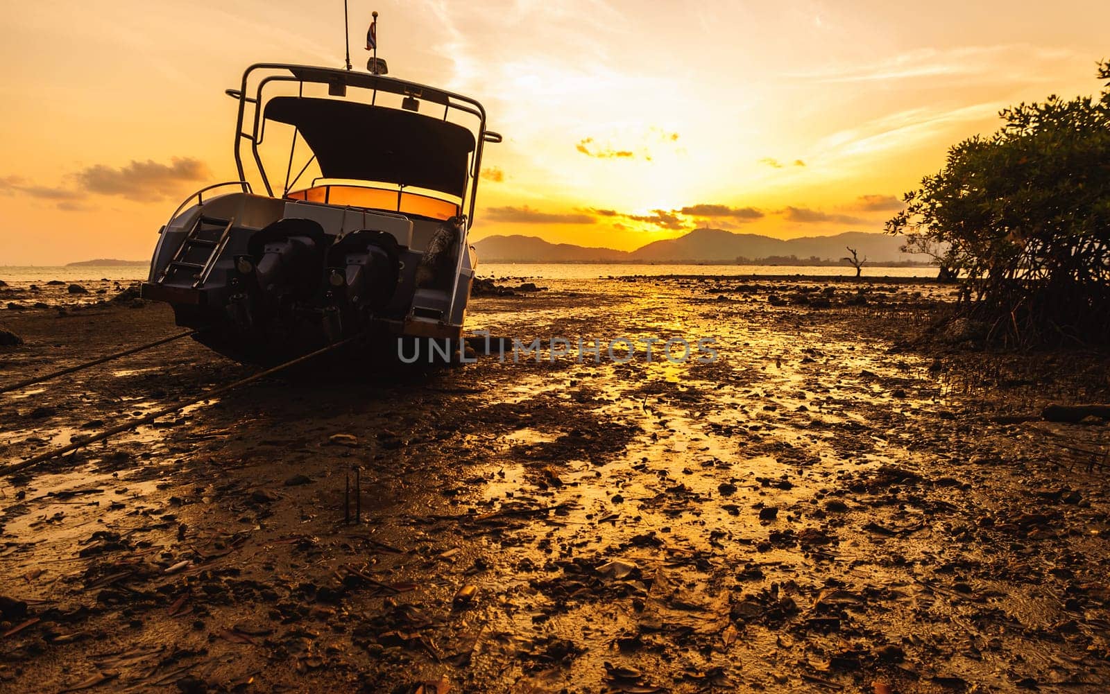Boat side on the beach with color of sunset, Phuket thailand