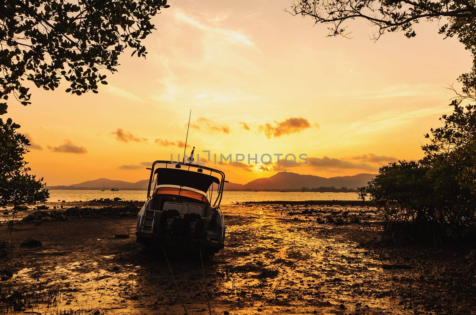 Boat on the beach with color of sunset, Phuket thailand