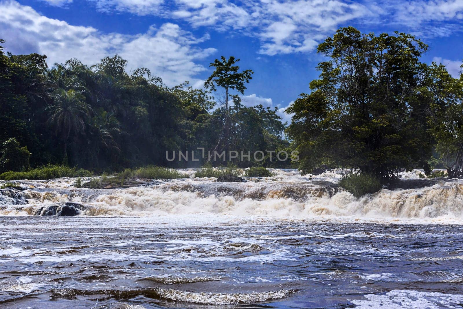 The wild Lobé stream pours into the Atlantic