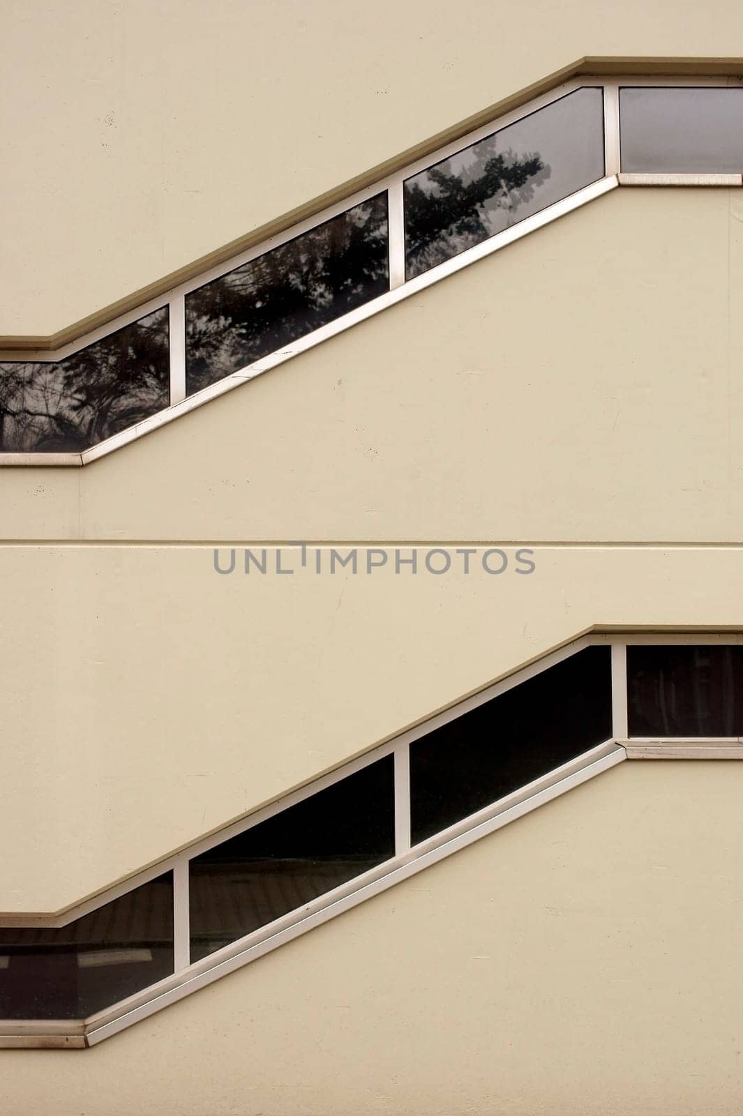 Two superimposed stairways with zigzag windows.
