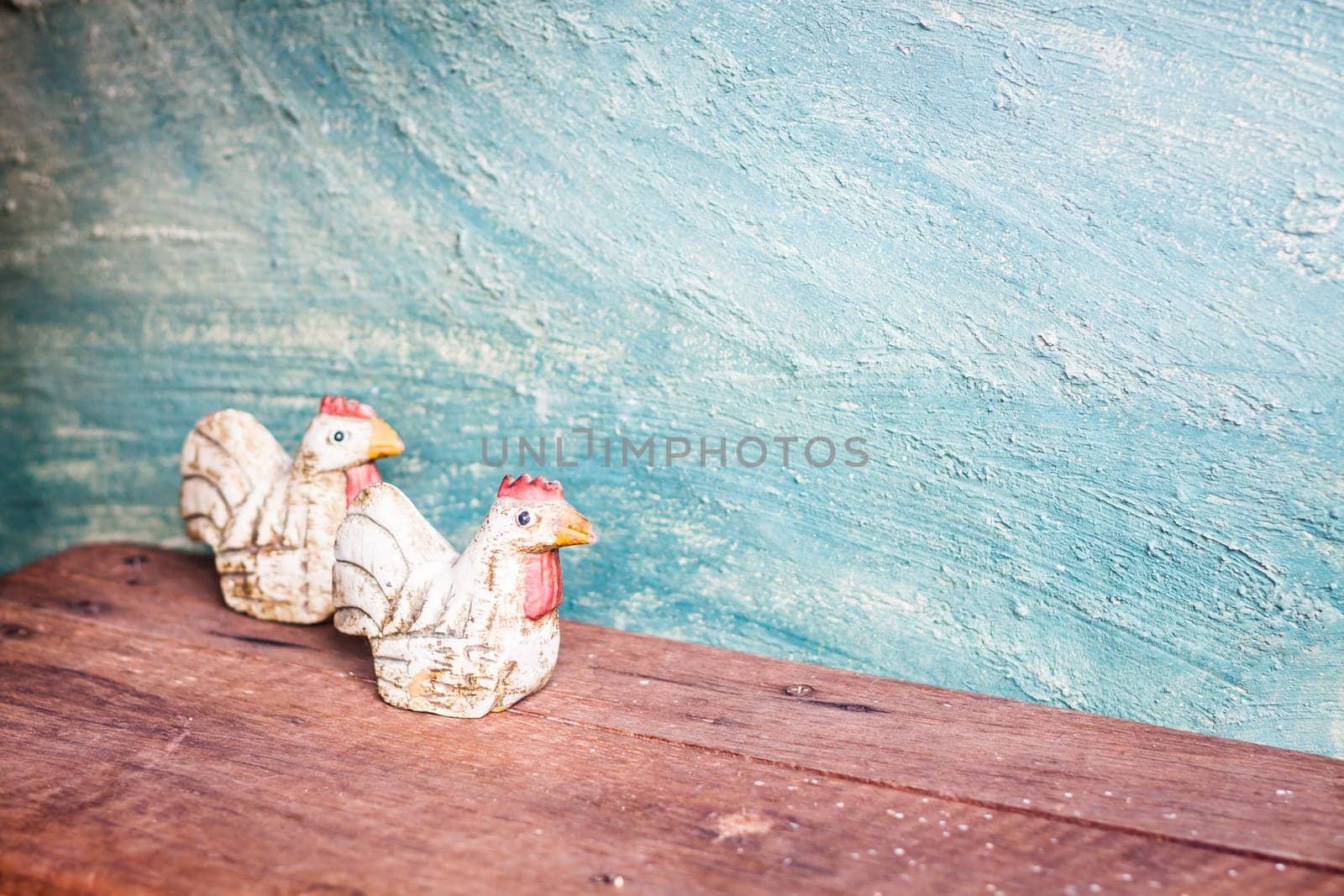 Chicken dolls with vintage green concrete background, stock photo