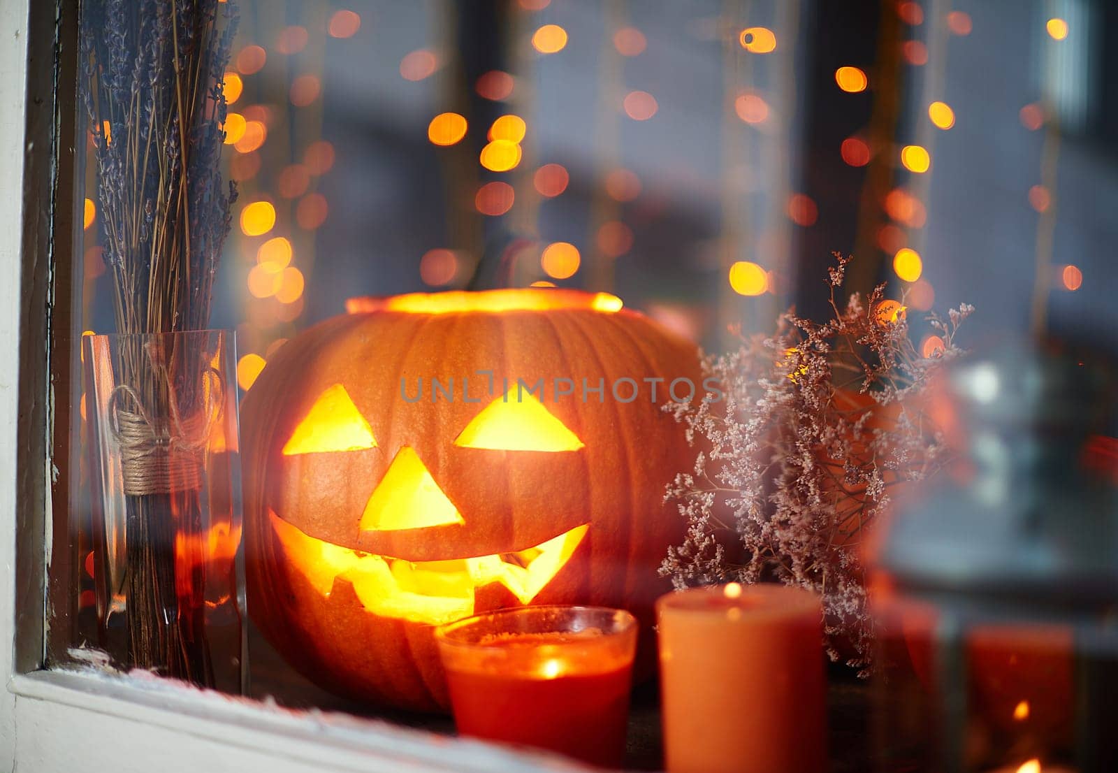 Halloween pumpkin with inside light and burning candles