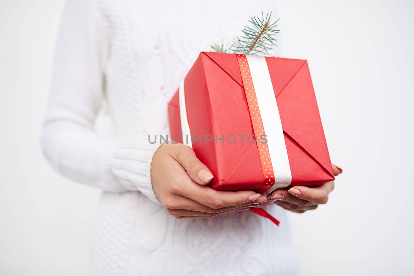 Giftbox with Christmas surprise in female hands