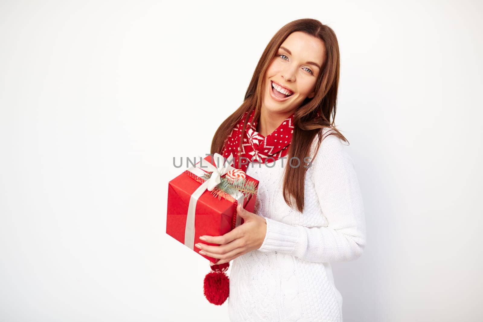 Joyful girl holding box with Christmas gift