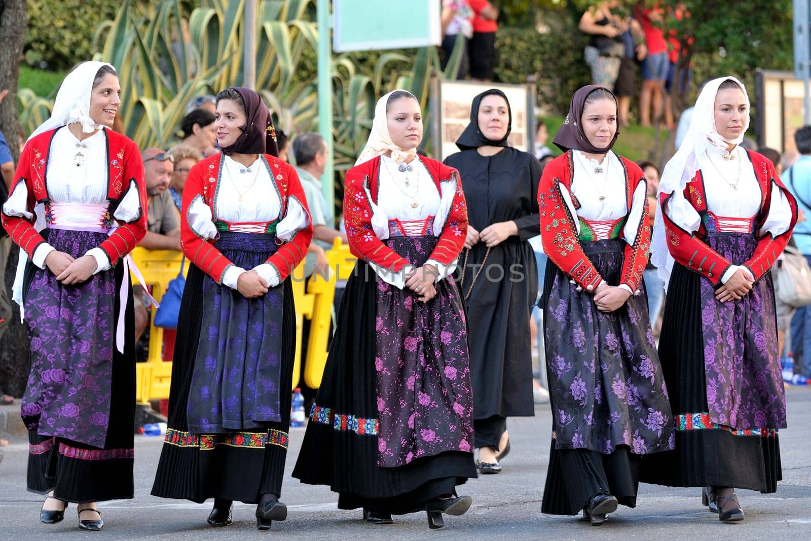 Nuoro, Sardinia, Italy - August 23, 2015: Parade of traditional costumes of Sardinia on the occasion of the Feast of the Redeemer of the Aug. 23, 2015 in Nuoro, Sardinia.