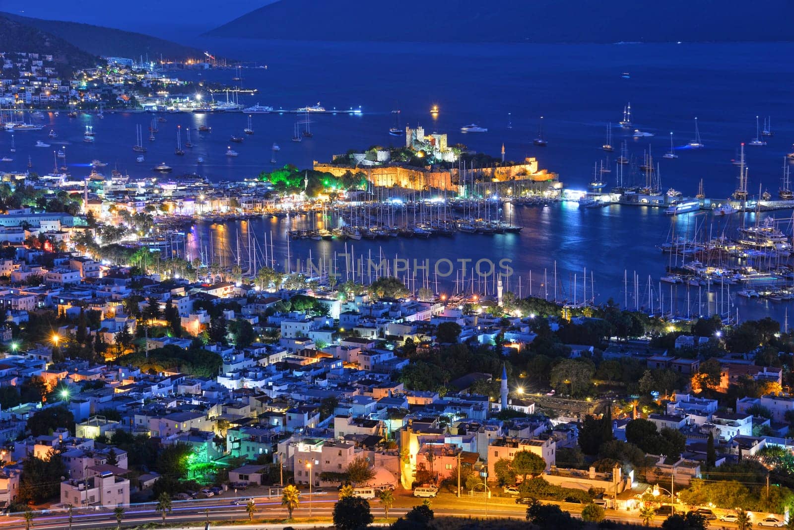 View of Bodrum harbor and Castle of St. Peter by night. Turkish Riviera.