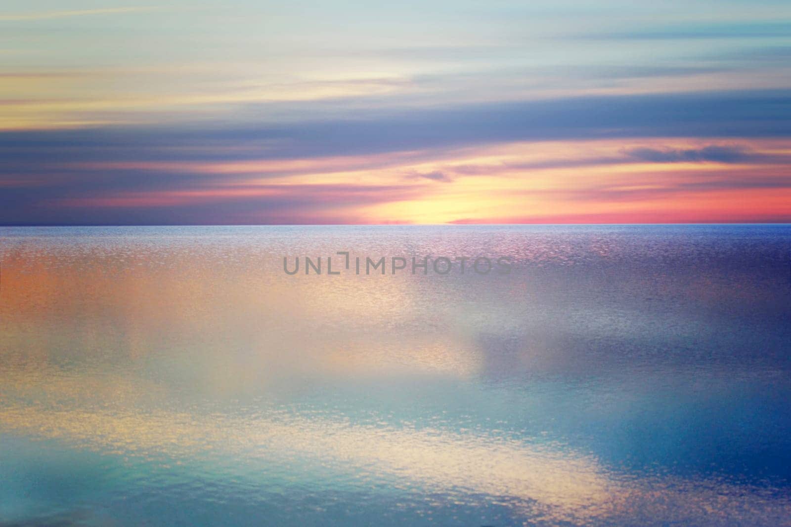 The North Sea rests quietly on the beach of St. Peter-Ording at sunset