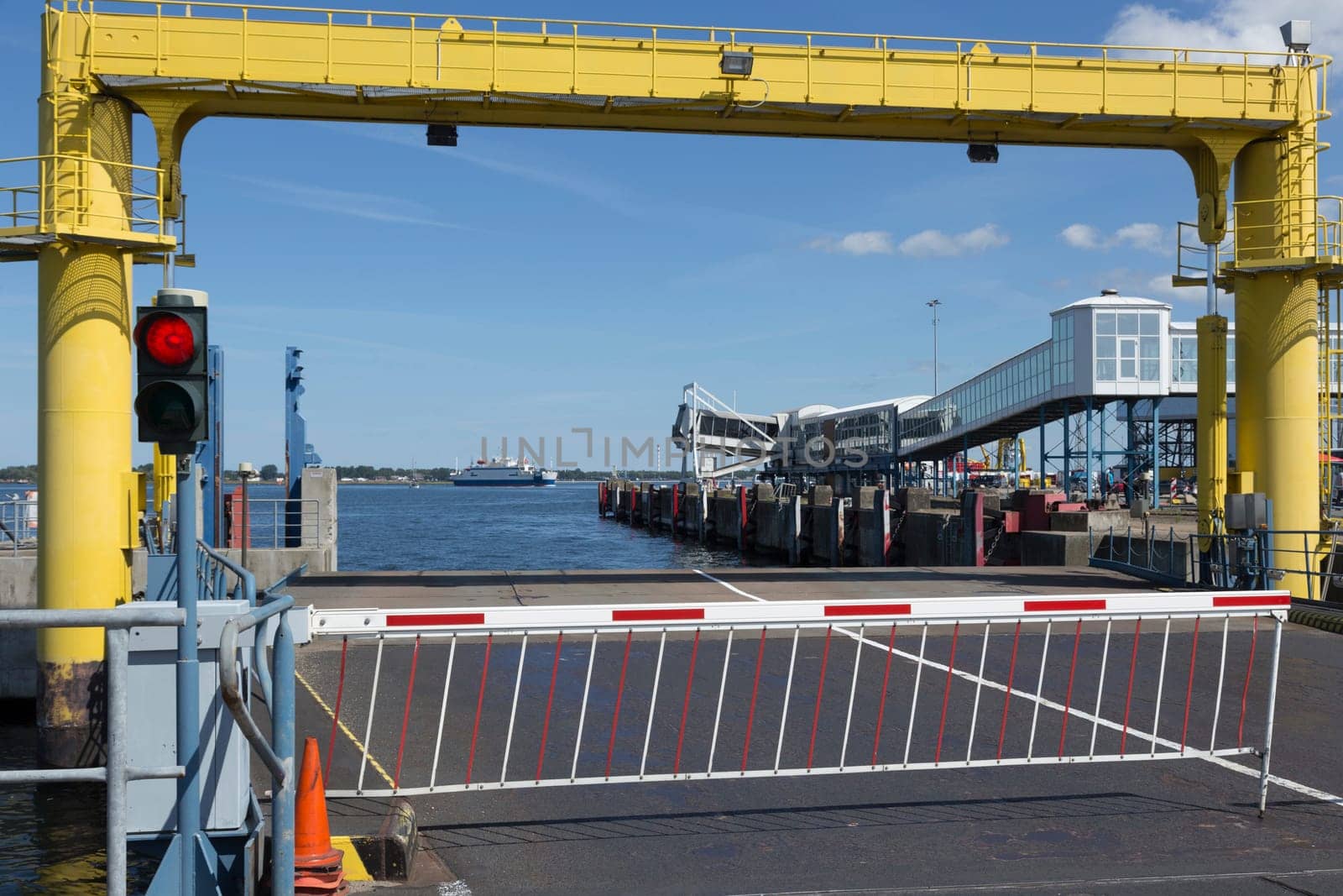 Barrier and traffic lights before the ferry access to Denmark