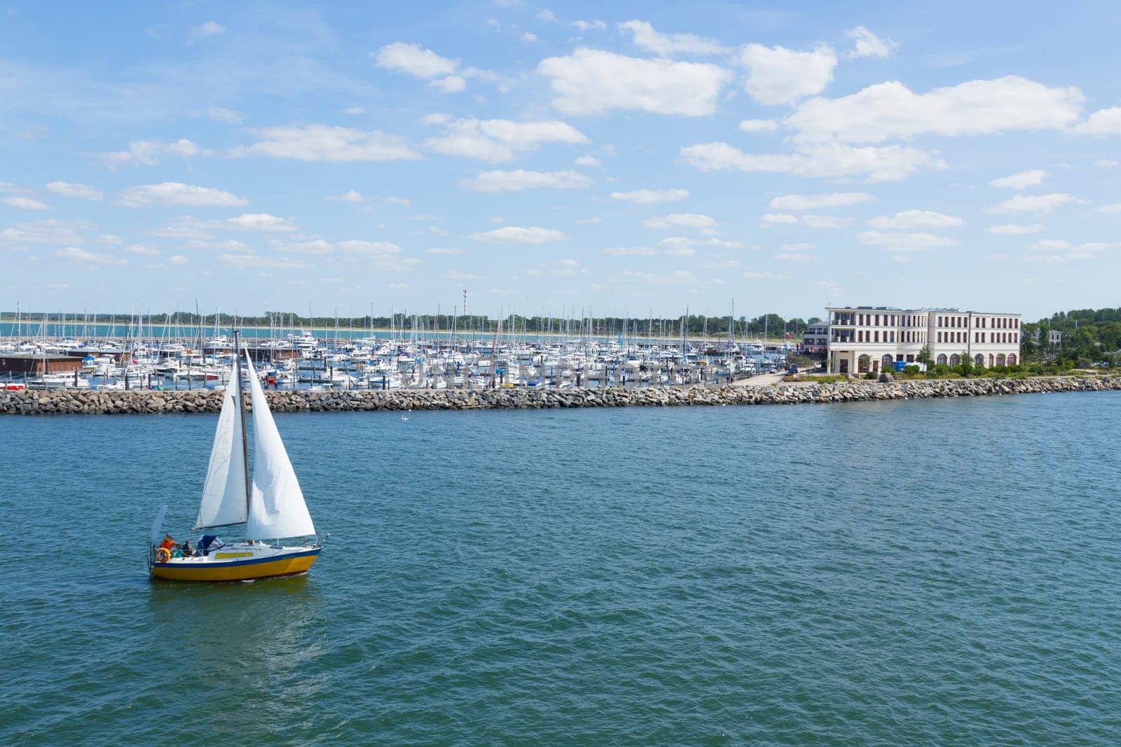 Sailboat in front of the marina Hohe Düne Warnemünde
