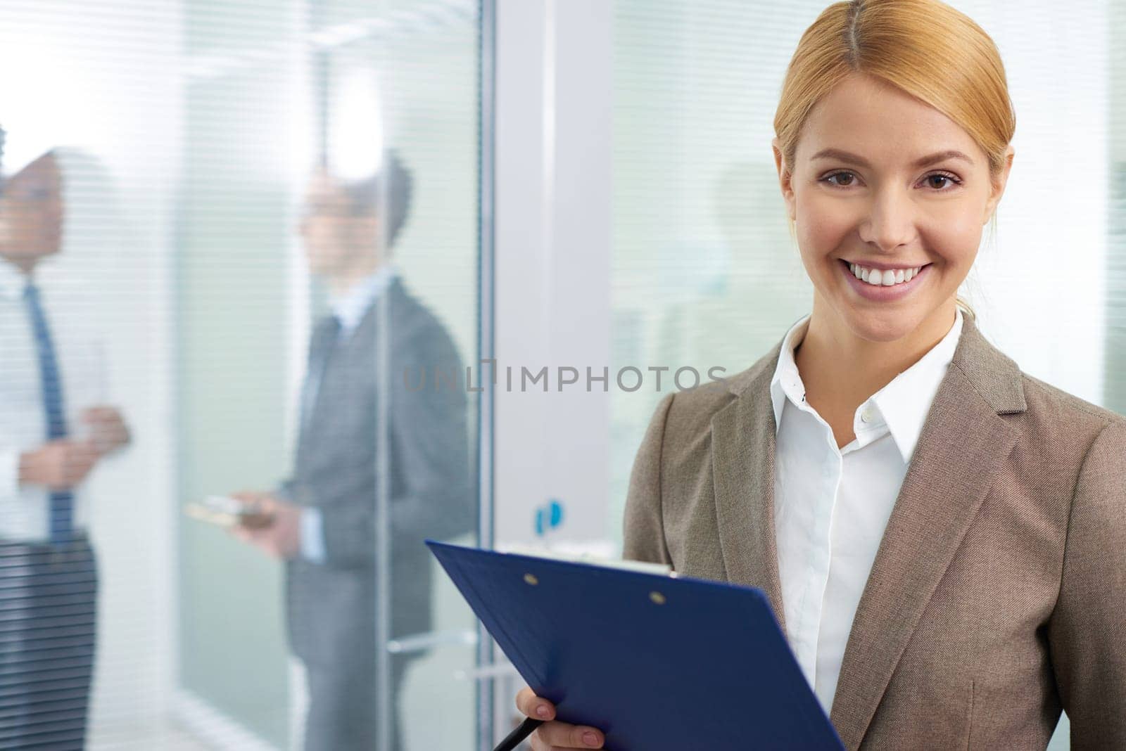 Successful employee in formalwear looking at camera in office