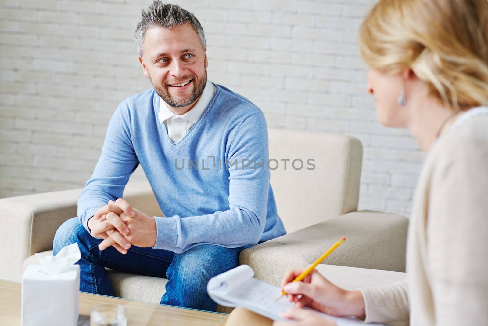 Happy patient talking to psychologist