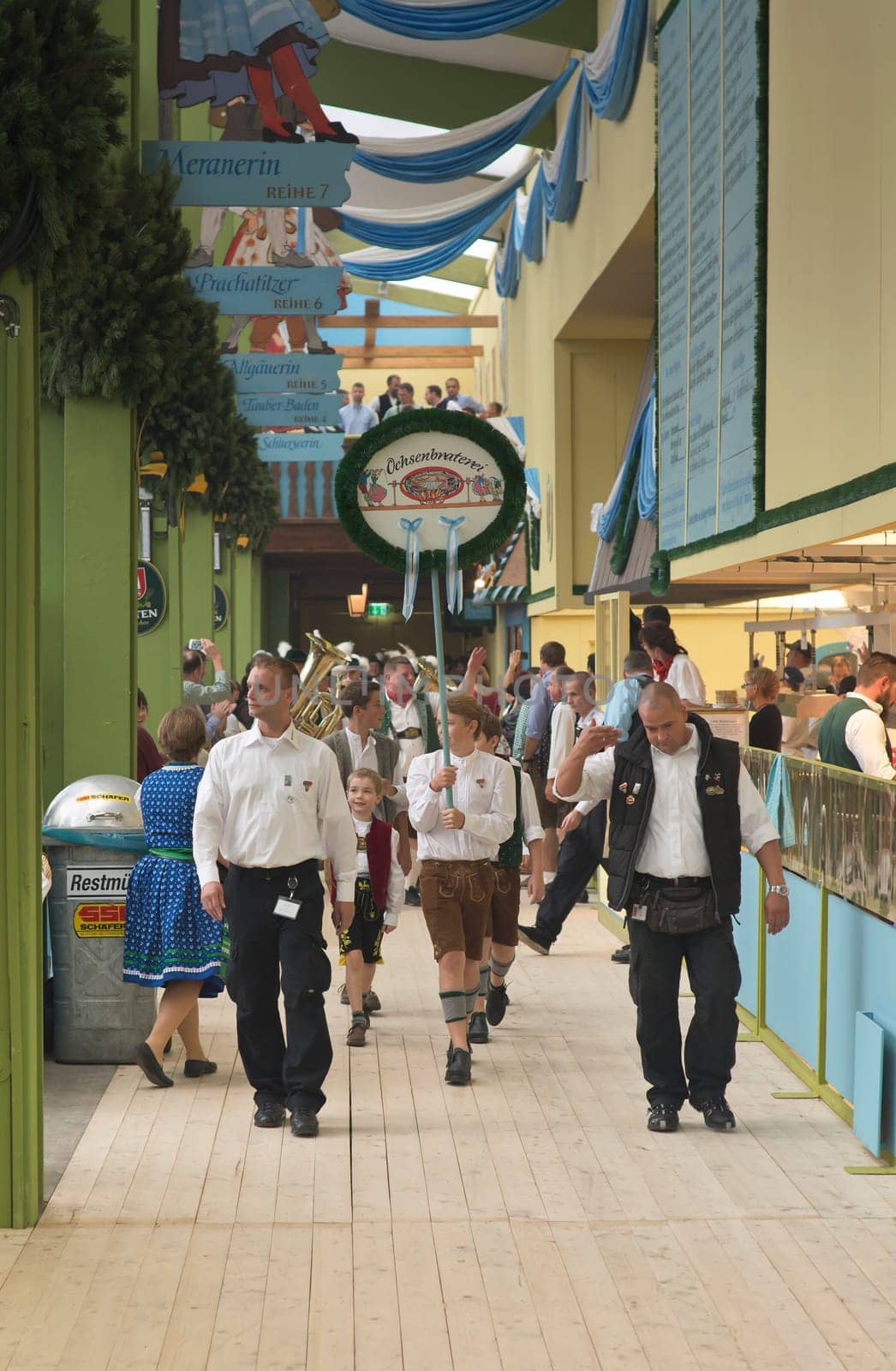 MUNICH, GERMANY – SEPT. 20, 2015: Traditional Marching Bands with Local Costumes entertain Crowds of visitors at the annual Oktoberfest. The Festival runs from September 19th until October 4th 2015 in Munich, Germany