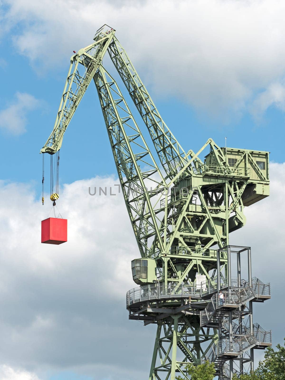 Boom crane with red cube