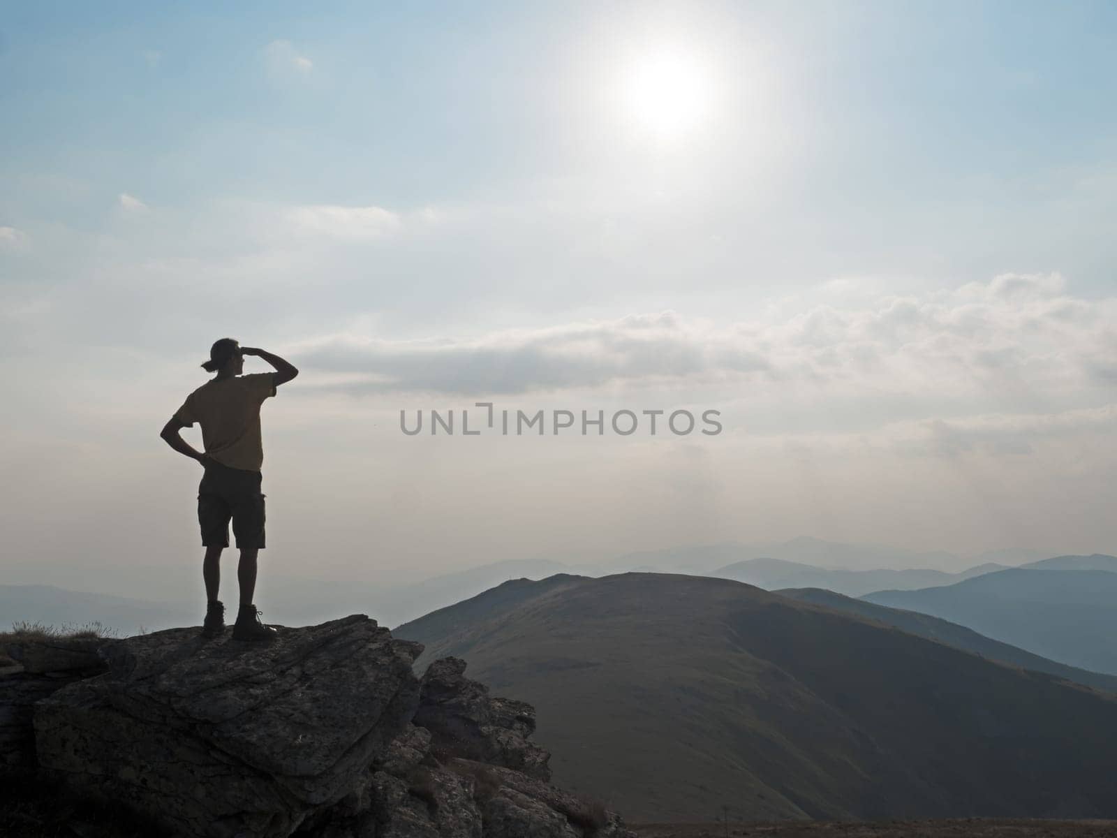 Hiker looks into the mountains