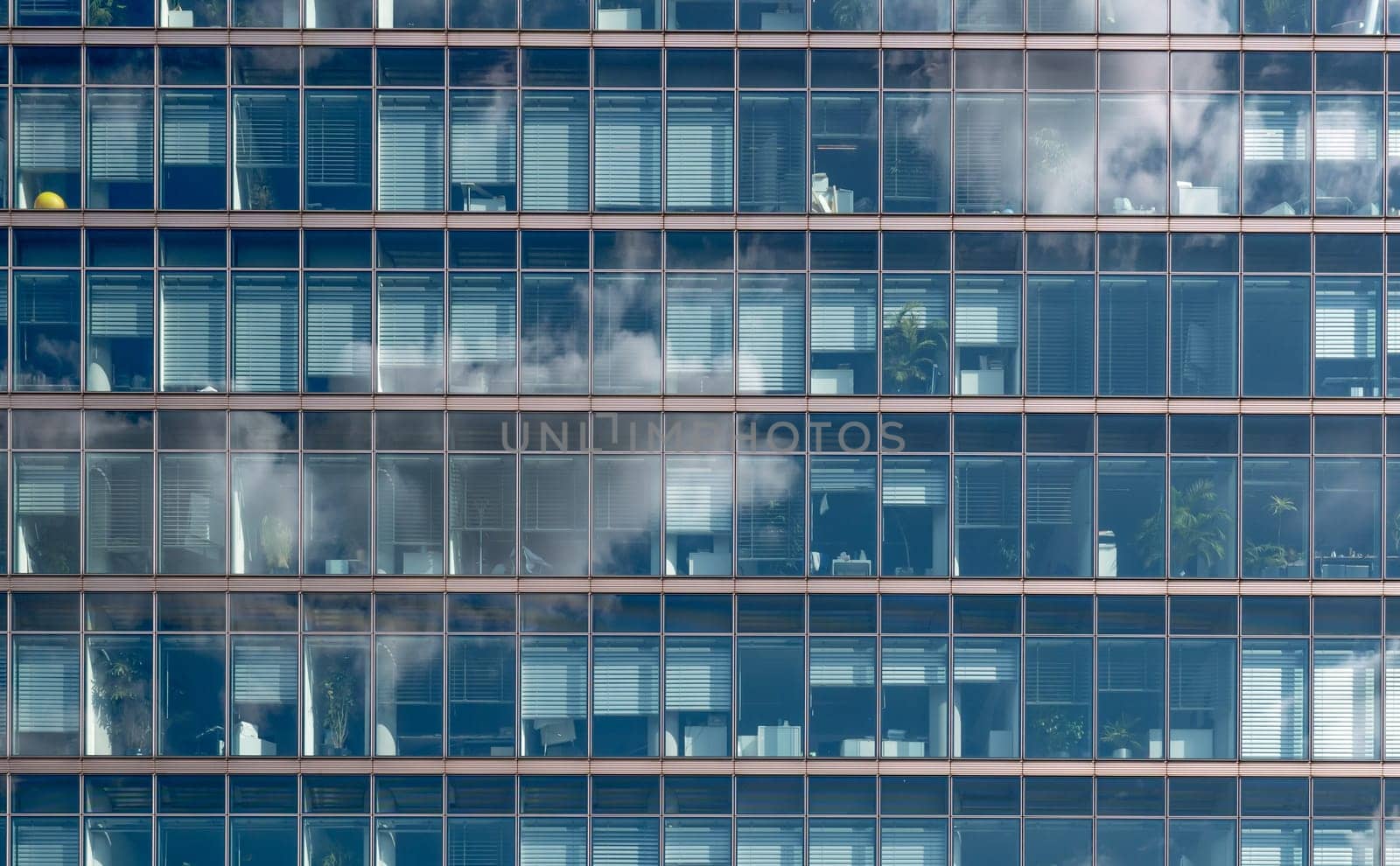 Facade of an office building with cloud mirroring