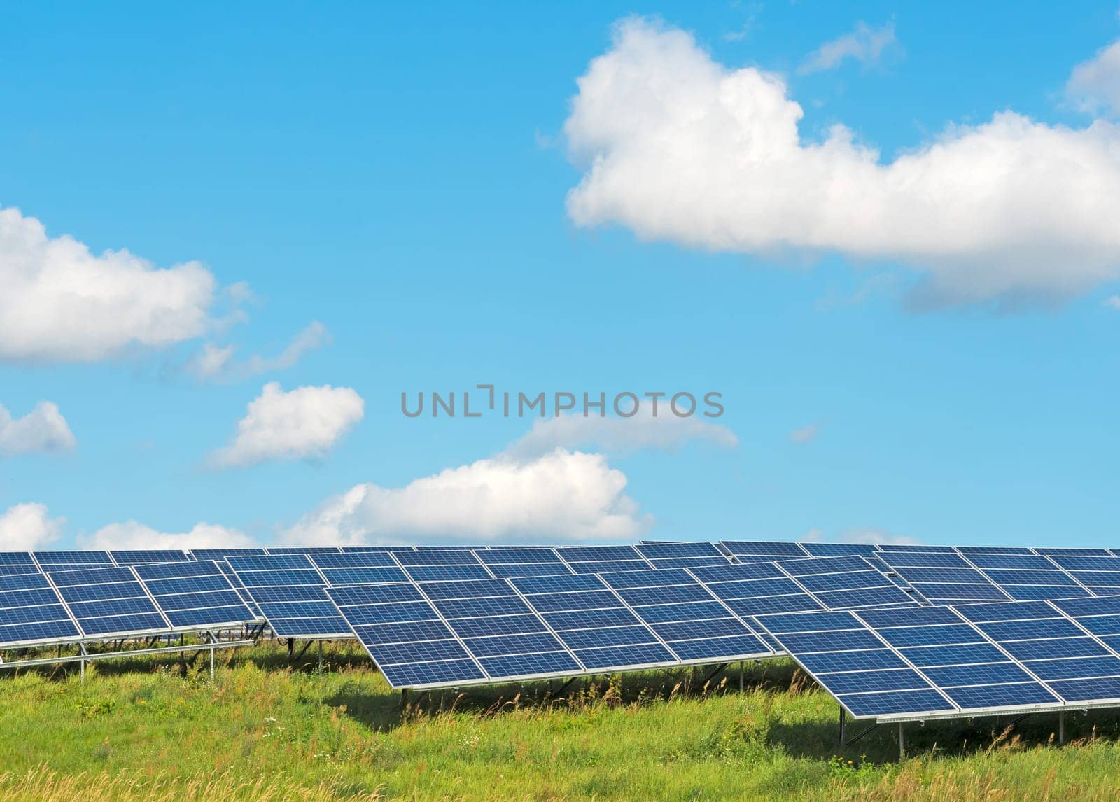 Solar power plant under a blue summer sky