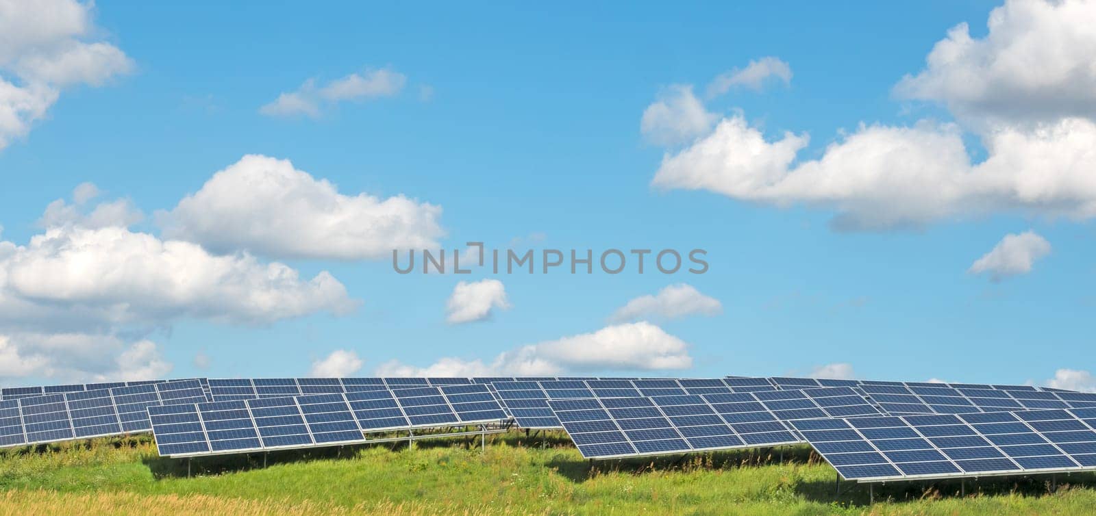 Solar power plant under a blue summer sky
