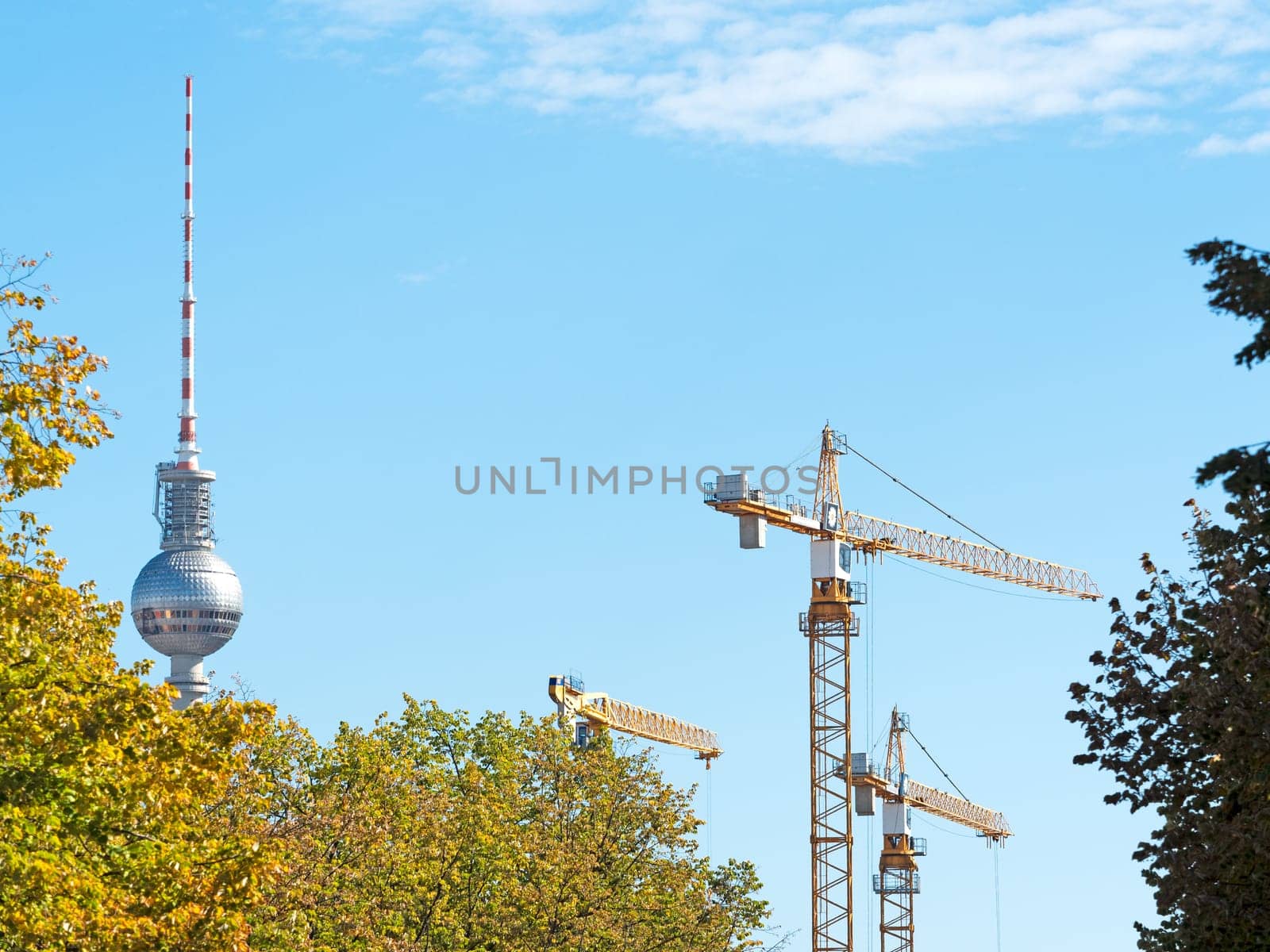 Construction cranes with TV tower in Berlin
