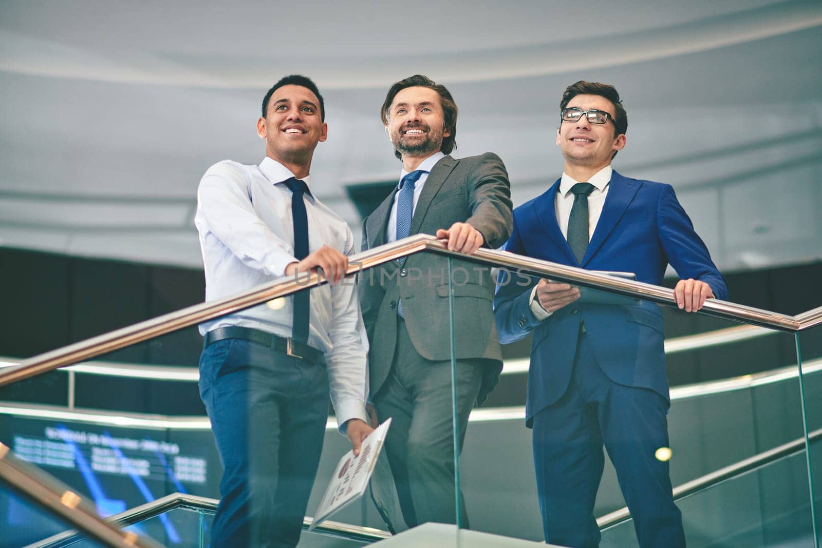 Group of elegant businessmen gathered at meeting