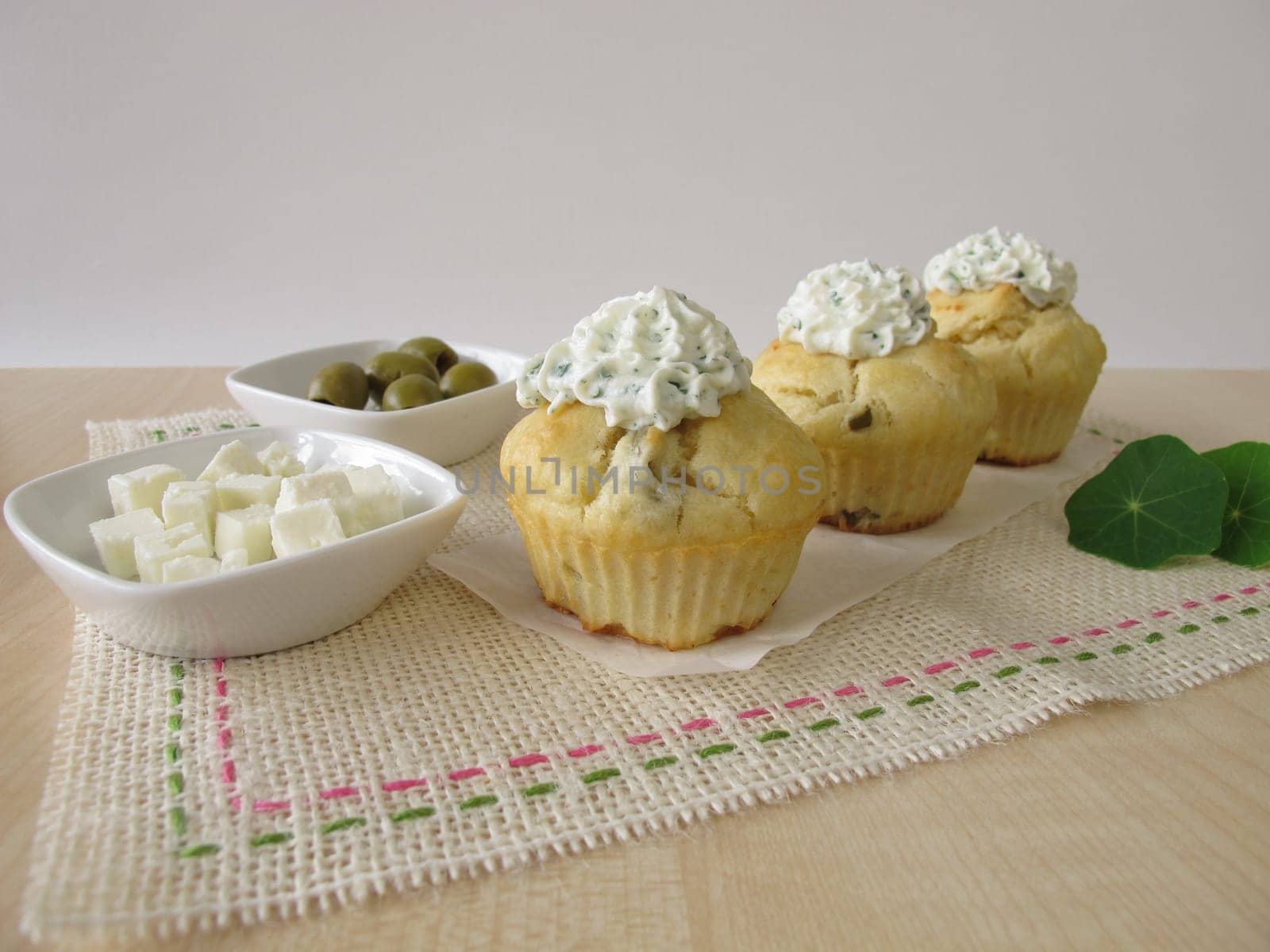 Cupcake with olives,feta cheese and herbal quark topping