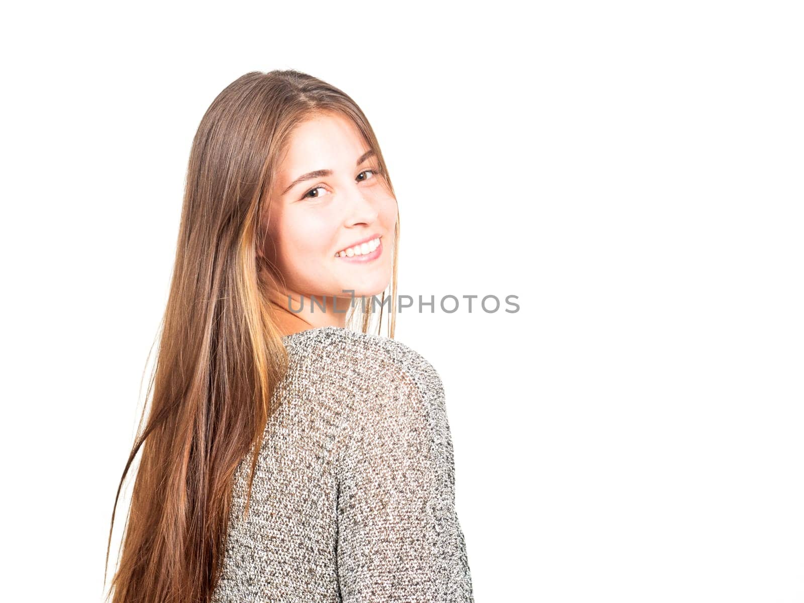 attractive young woman looks over her shoulder