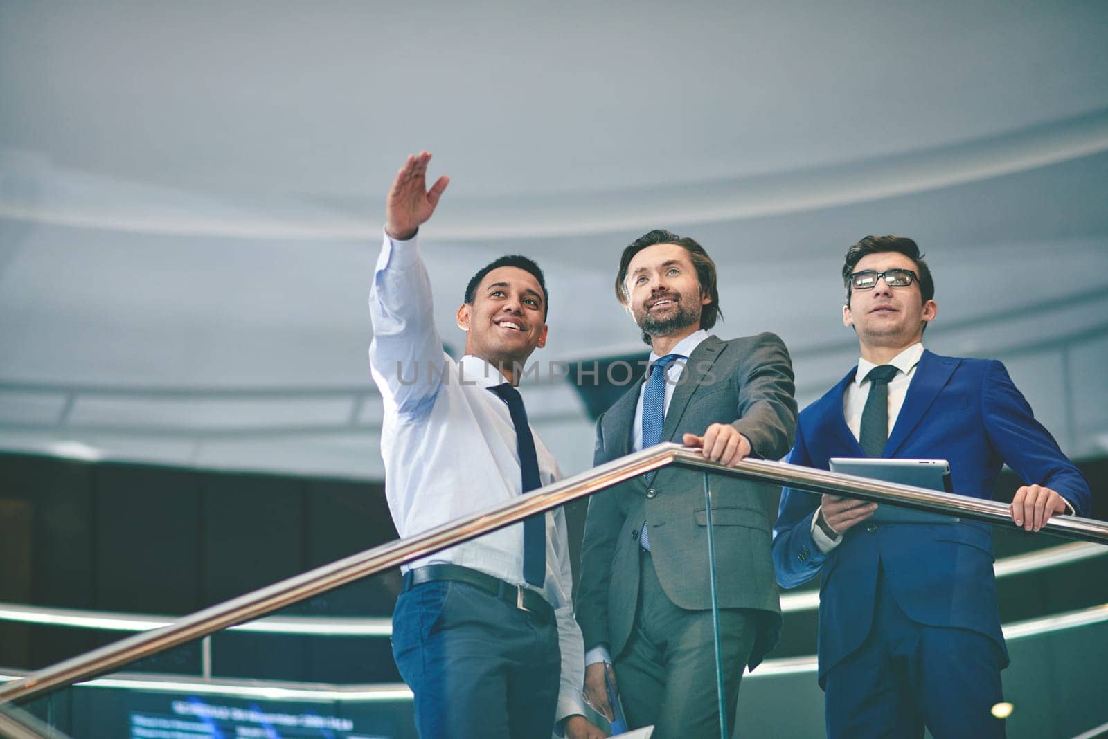 Group of successful businessmen discussing something
