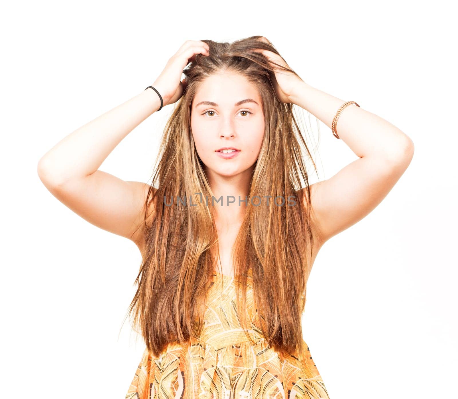 attractive young woman grabs her hair