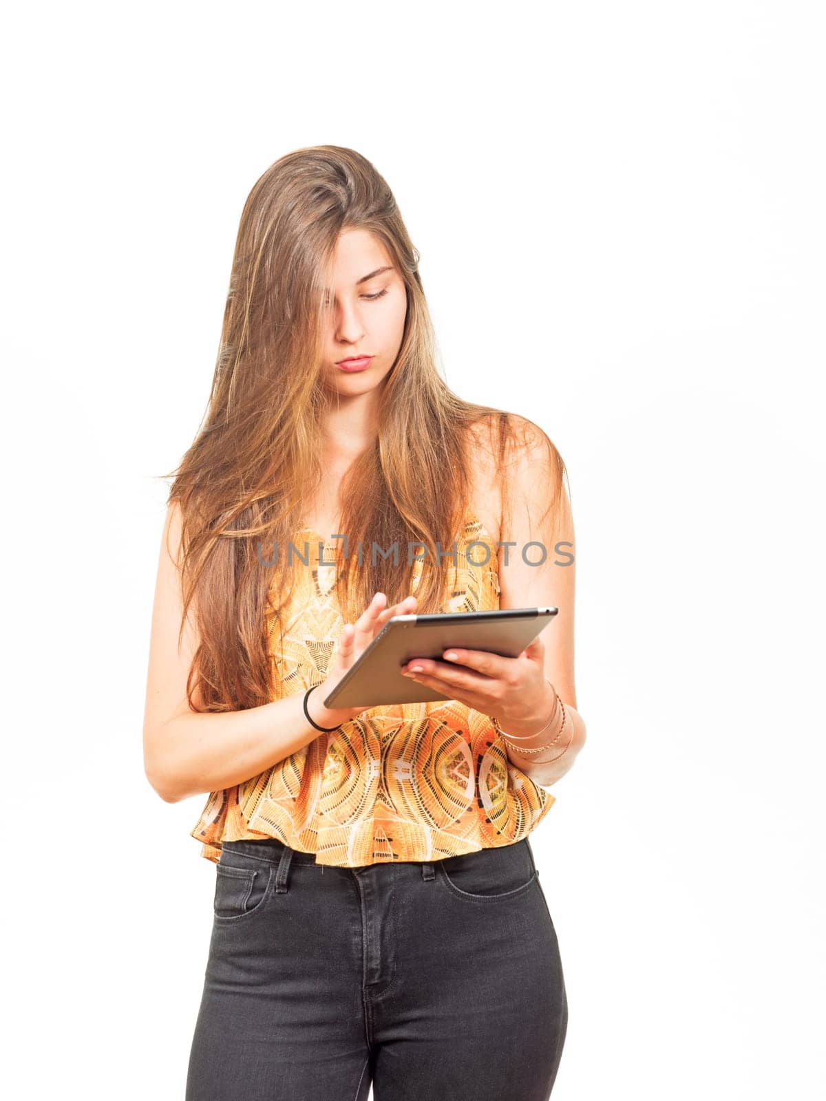 attractive young woman surfing on a tablet
