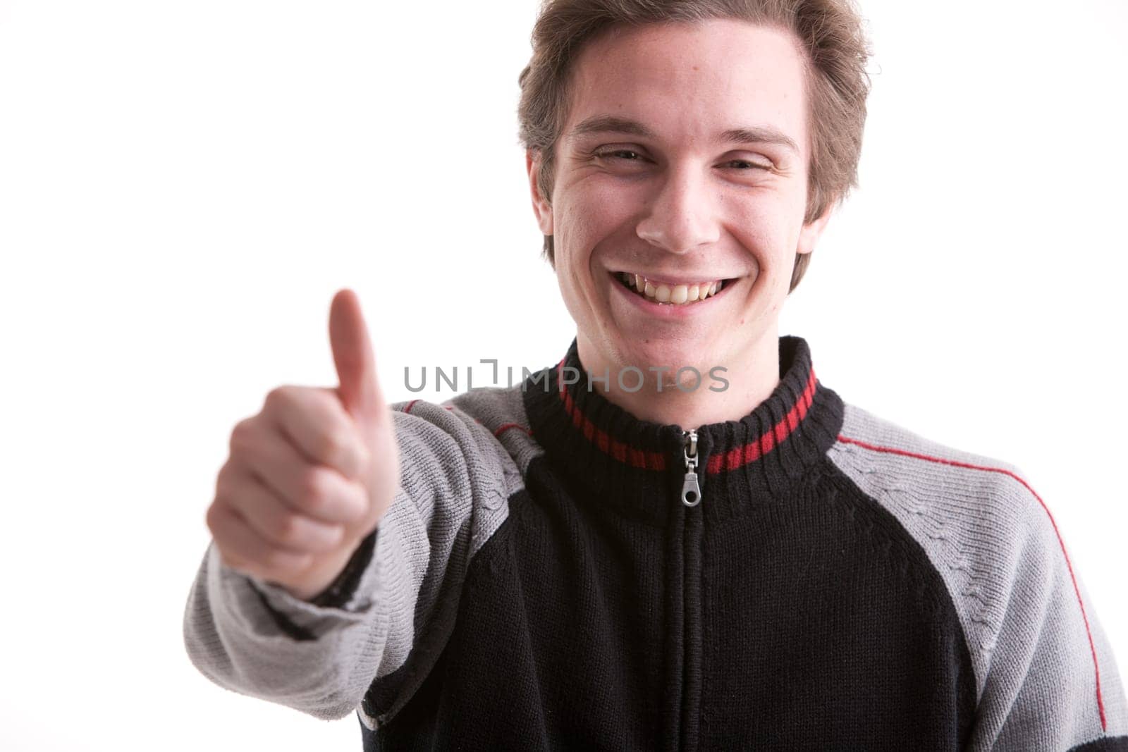 thumbs up by young man smiling