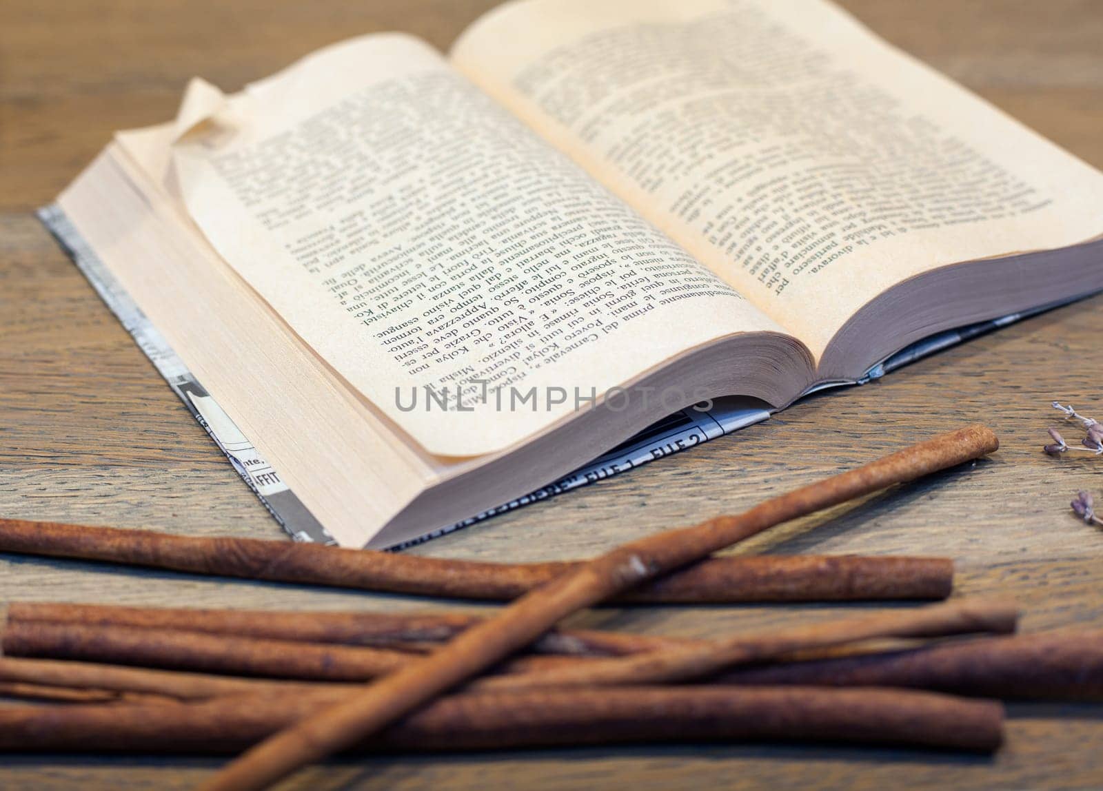 Close up of open book on wooden table