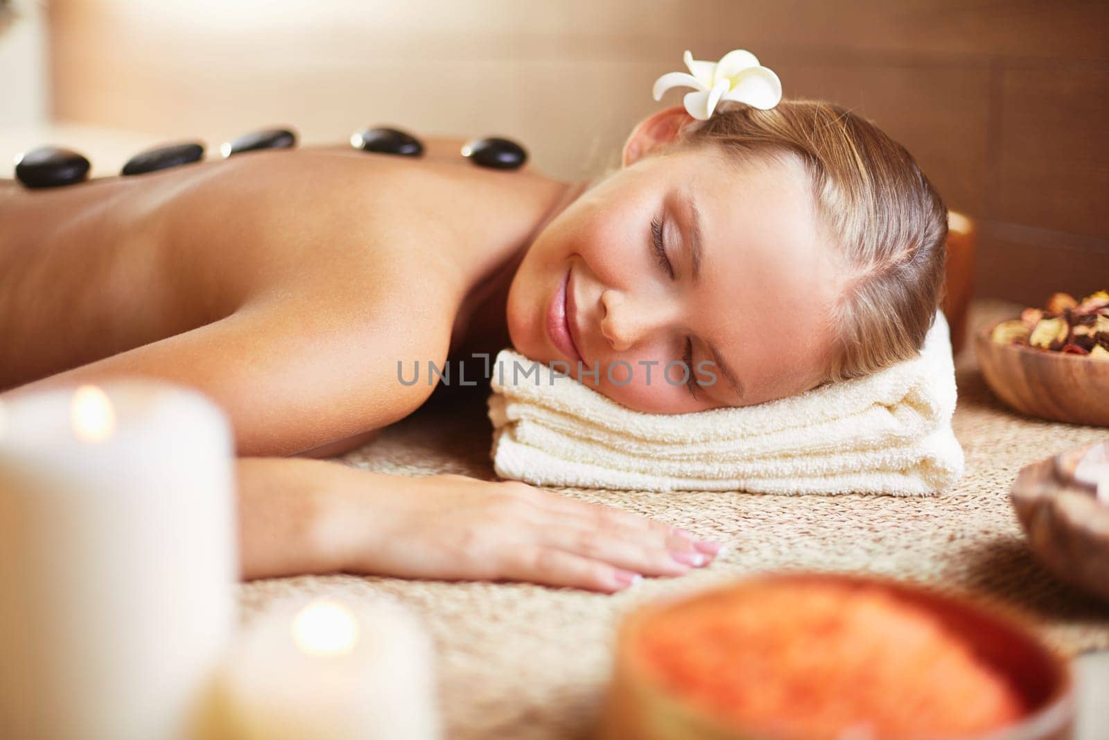 Peaceful woman enjoying spa procedure
