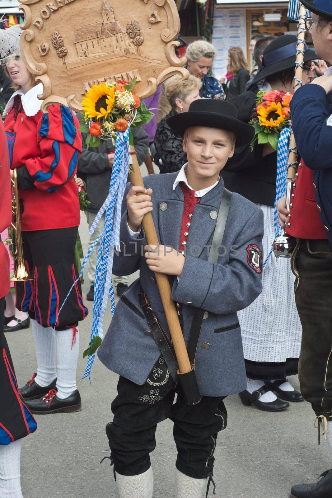 MUNICH, GERMANY – SEPT. 20, 2015: Traditional Marching Group with Local Costumes entertain Crowds of visitors at the annual Oktoberfest. The Festival runs from September 19th until October 4th 2015 in Munich, Germany.