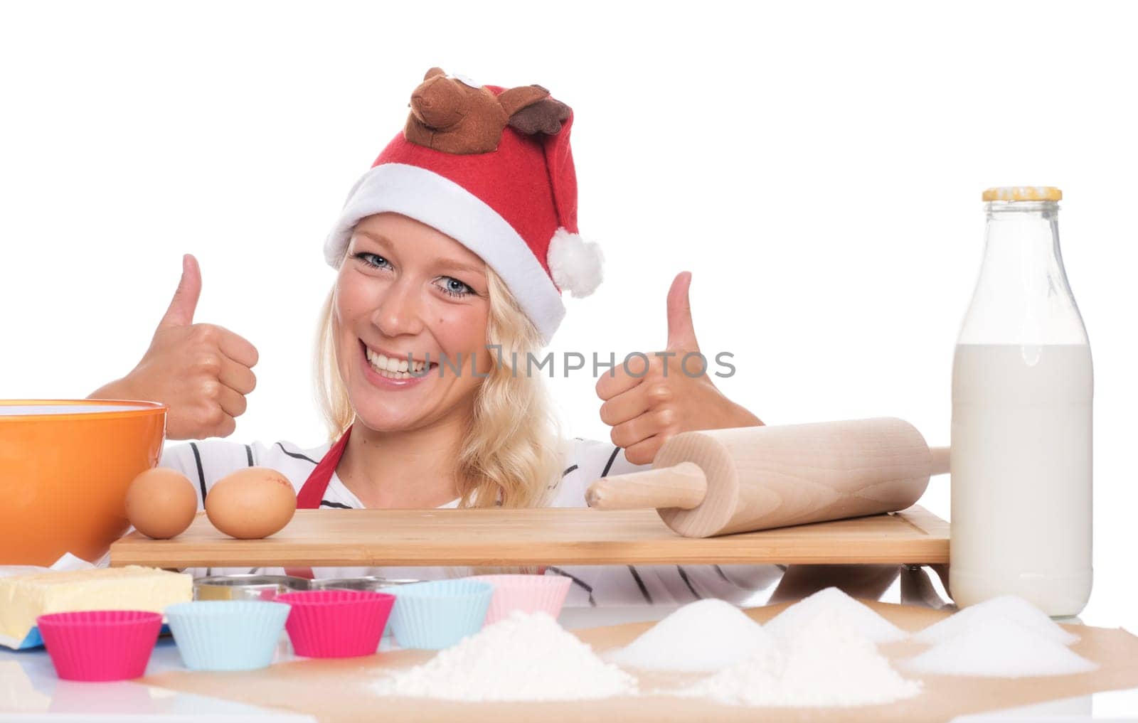 Woman with Christmas hat wants to bake biscuits