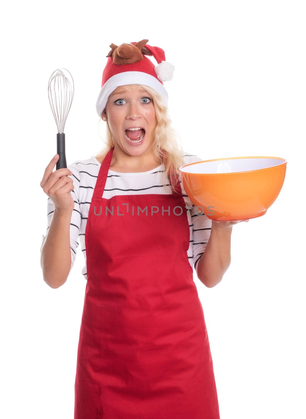 Excited Christmas woman in apron holds a bowl and a quirl