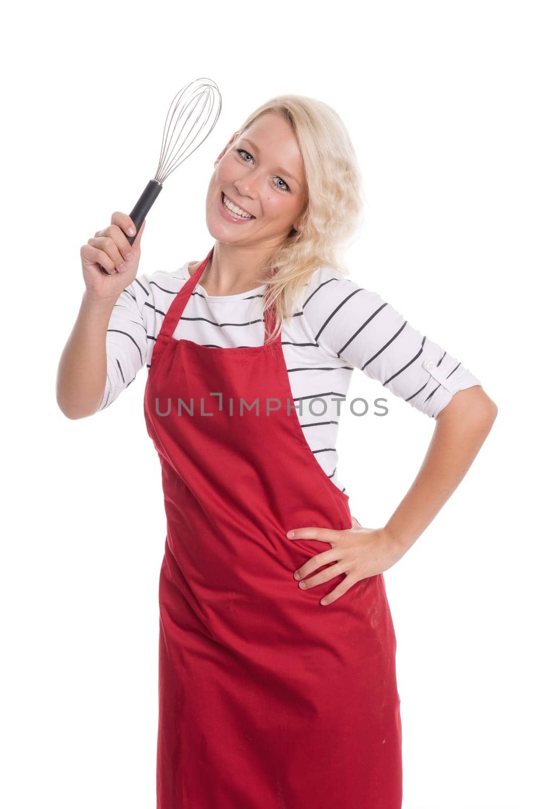 Housewife in red apron holds a whisl