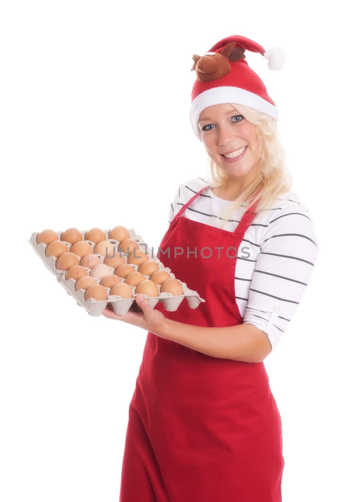 Woman with Christmas hat and apron holds a palette of eggs