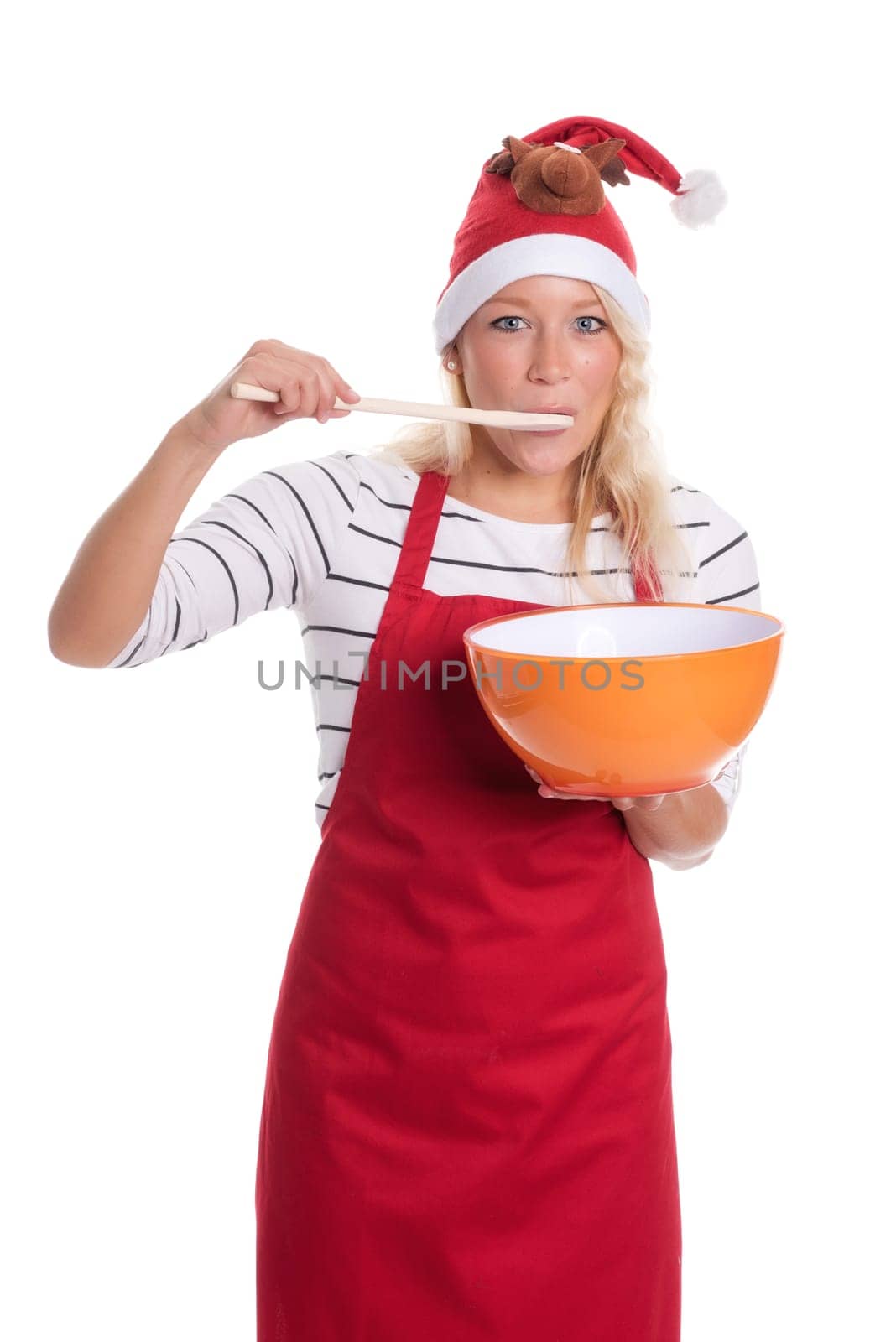 Christmas woman in apron with bowl and wooden spoon